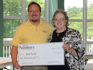 Salisbury University 2012 Employee of the Year Todd Smith receives a check from Provost and Senior Vice President of Academic Affairs Diane Allen.